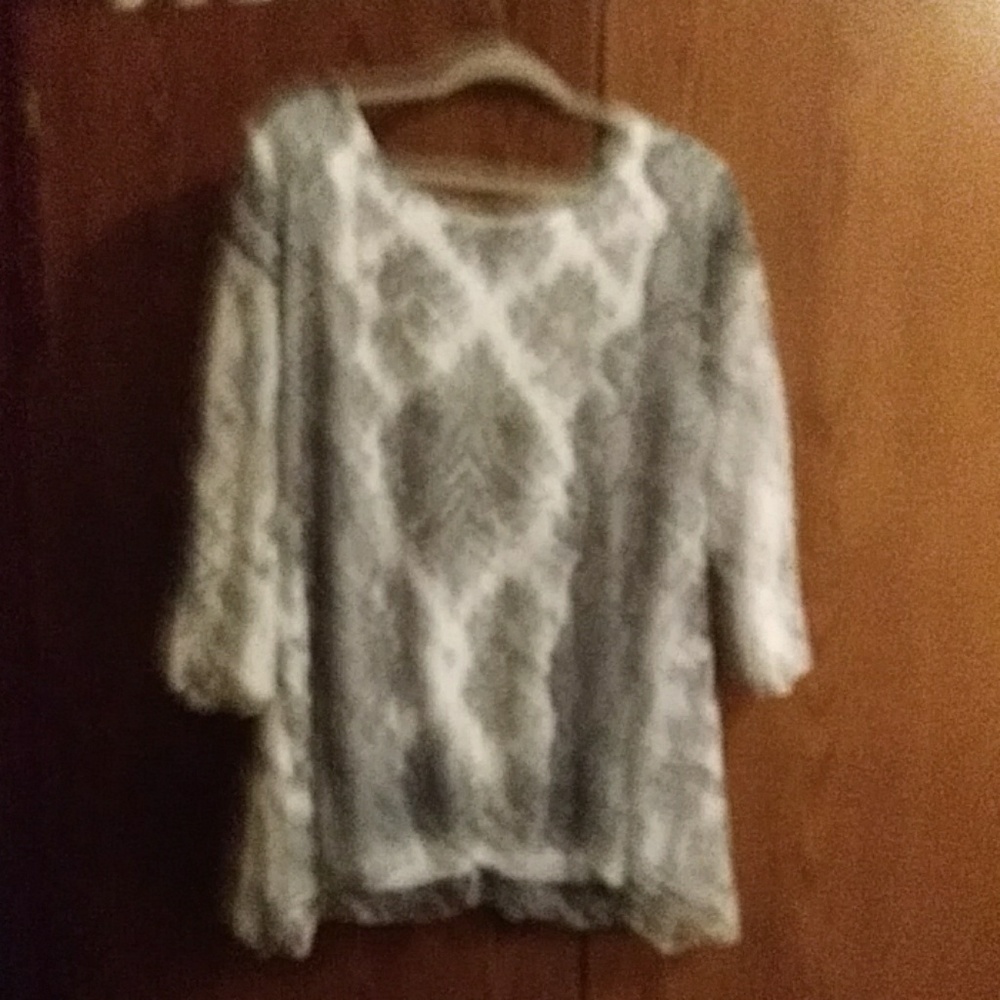 A black and white beaded tunic